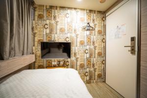 A bed or beds in a room at The Cole Hotel