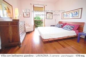 Postel nebo postele na pokoji v ubytování Villa Marinin - con splendido giardino e vicino ad oasi naturalistica