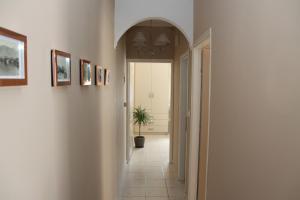 a hallway with a plant in the middle of a room at Asteri Apartments Mytikas 2-Bedroom Seaview Courtyard in Mitika