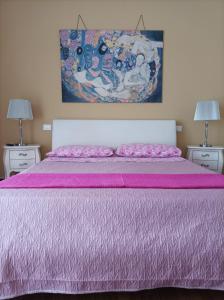 En eller flere senge i et værelse på La casa di Annalisa