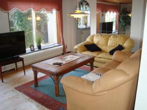 a living room with a couch and a coffee table at 2 room apartment in Ystad