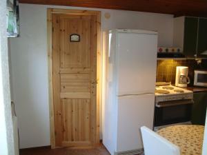 a kitchen with a white refrigerator and a stove at 2 room apartment in Ystad +11 photos