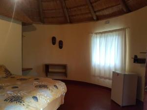 Postel nebo postele na pokoji v ubytování Lituba Lodge