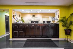 a waiting room with a counter in a restaurant at Quality Inn & Suites near Six Flags - Austell in Austell