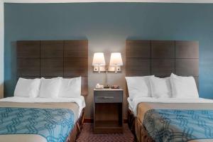 Tempat tidur dalam kamar di Americas Best Value Inn Gettysburg
