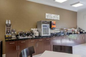a large kitchen with a large counter top at Sleep Inn & Suites Cave City in Cave City