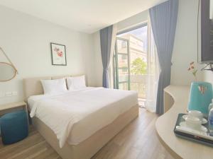 Postel nebo postele na pokoji v ubytování Minh Anh Hotel + 37 fotografií