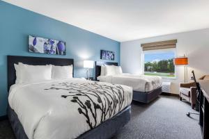 Ένα ή περισσότερα κρεβάτια σε δωμάτιο στο Sleep Inn Winfield - Teays Valley +29 φωτογραφίες
