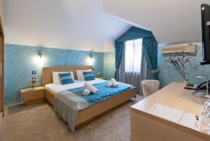 Voodi või voodid majutusasutuse Euro Garni Hotel toas