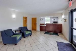 a waiting room with two chairs and a desk at Quality Inn - Roxboro South in Roxboro
