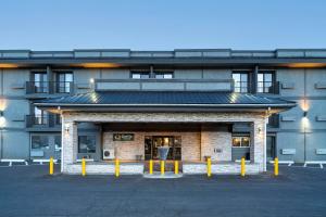 a building with a parking lot in front of it at Quality Inn & Suites in Vernon