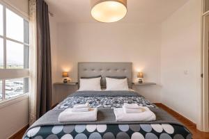 a bedroom with a large bed with two towels at Casa Manuela in Callao Salvaje +46 photos
