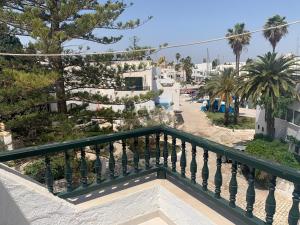 a balcony with a view of a street at Charmant logement front port et Mer in Port El Kantaoui