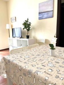 a dining room table with a table cloth on it at Camp Nou Apartment WiFi in Barcelona