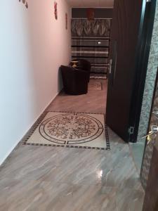 a hallway with a rug on the floor in a room at Luxuries Beta in Saturn