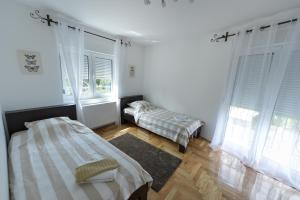 Cama o camas de una habitación en Park Srce Apartments