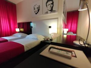 Postel nebo postele na pokoji v ubytování Hotel L' Orto degli Otelli