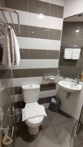 Koupelna v ubytování Agogo Downtown Hotel Surabaya