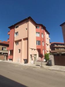 a large building on the side of a street at Guest House Polikseni in Sozopol