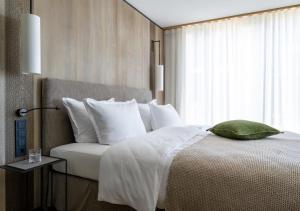 Postel nebo postele na pokoji v ubytování Hotel Hirschen Horn