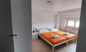 Łóżko lub łóżka w pokoju w obiekcie Appartamento Elipa