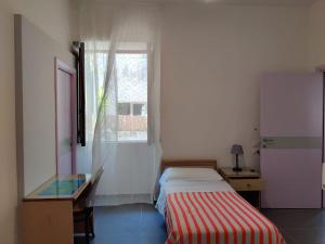 Postel nebo postele na pokoji v ubytování Hotel Villa Cecilia