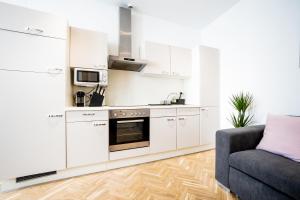 A kitchen or kitchenette at Modern and lovely apartment next to subway station