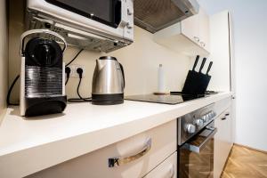 A kitchen or kitchenette at Modern and lovely apartment next to subway station