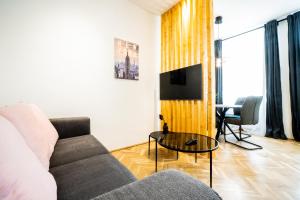 A television and/or entertainment centre at Modern and lovely apartment next to subway station
