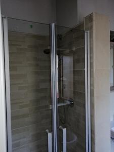 a shower with a glass door in a bathroom at B&B Lamezia Nicogia in Lamezia Terme