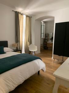 Postel nebo postele na pokoji v ubytování Location de vacances Île rousse