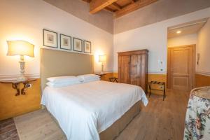 Postel nebo postele na pokoji v ubytování Relais di Campagna I Tamasotti