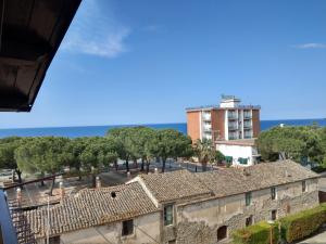 a view from the roof of a building with trees and the ocean at Franita in Rossano