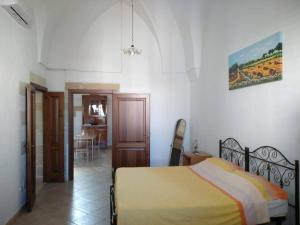 A bed or beds in a room at Regina Elena Casa Vacanze Salento