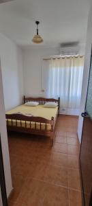 a bedroom with a bed in a room at Roan Apartments in Velipojë +14 photos