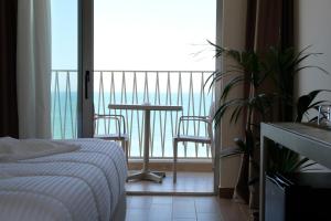 Postel nebo postele na pokoji v ubytování Fllad Resort & SPA Durres