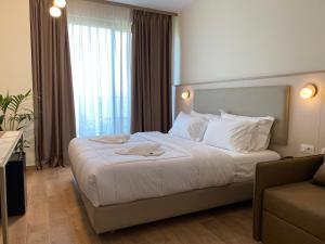 Postel nebo postele na pokoji v ubytování Fllad Resort & SPA Durres