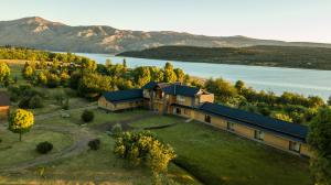 an aerial view of a house with a lake at Lago Rosario Lodge in Trevelin
