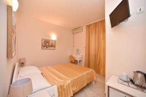 Postel nebo postele na pokoji v ubytování Apartment Plazza Rafailovici