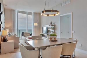 a dining room with a table and chairs at Penthouse Condo at Lyfe Resort and Residences in Hollywood