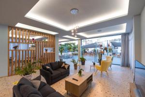 a living room with a couch and a table at Vivari Acta in Vivari