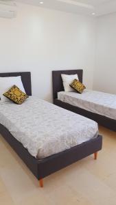 Postel nebo postele na pokoji v ubytování Appartement Corniche en bord de mer