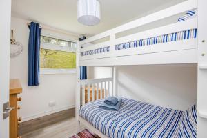 a bedroom with a bunk bed and a bunk crib at 328 Norton Park, Dartmouth in Dartmouth