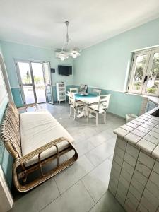 a bedroom with a bed and a table in it at Capovaticano - Unique SEA VIEW - Villa Renaissance in Santa Maria