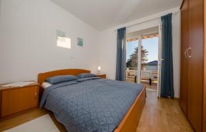 Postel nebo postele na pokoji v ubytování Apartments Kordić