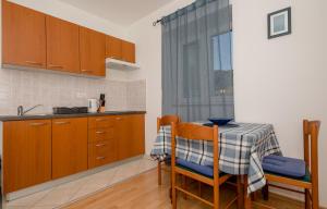 Kuchyň nebo kuchyňský kout v ubytování Apartments Kordić