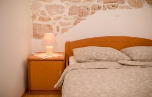 Postel nebo postele na pokoji v ubytování Apartments Kordić
