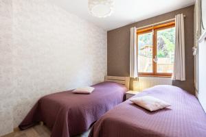 Posteľ alebo postele v izbe v ubytovaní Le Repère Des Marmottes