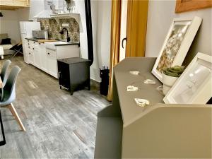 a kitchen with a counter and a table with a counter top at Casa Rural El Altillo in Letur