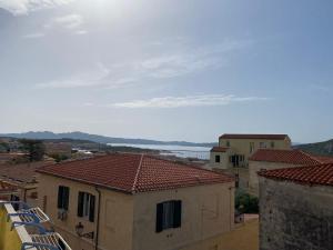 a view of a town with buildings and a lake at Casa Balilla in La Maddalena
